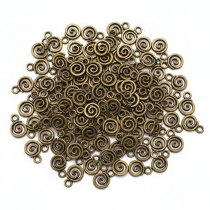 May include: A collection of bronze-colored spiral charms with small loops for attaching to jewelry or other crafts. The charms are in various sizes and arranged on a white background. These decorative charms are ideal for DIY projects.