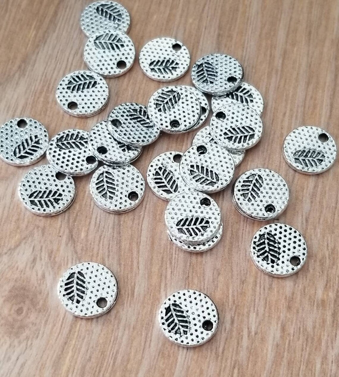 Small Rund Charm 10 Mini Round Charms With Leaf Cut Out Design Textured Doubled Sided ...