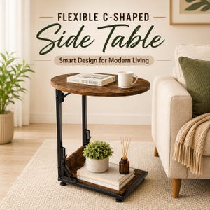 May include: A C-shaped side table with a dark wood grain oval top and a black metal frame. The table features a lower shelf holding a potted plant, a glass bottle with reed diffusers, and books. Text reads: FLEXIBLE C-SHAPED Side Table Smart Design for Modern Living.