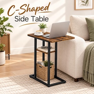 May include: A C-shaped side table with a dark brown wood-grain top and a black metal frame. The table features a middle shelf holding a book and glasses, and a bottom shelf containing a woven basket with a plant. Text reads C-Shaped Side Table.