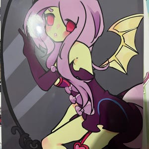 May include: A rectangular print featuring a stylized anime character with light pink hair, pale green skin, and red eyes. The character wears a dark purple outfit with small bows and bat-like wings. The text flutterbat and YENO CHUMI are visible.