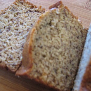 May include: Three slices of banana bread, each with a different texture and color. The bread is light brown and has a slightly crumbly texture.