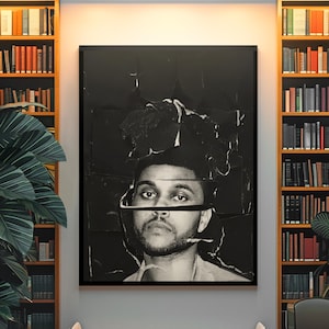 May include: A rectangular wall art print featuring a black and white portrait of a person with a beard, presented with a distressed, layered paper effect that creates horizontal visual breaks across the face and hair, framed in a thin black border.