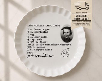May include: A white ceramic fluted tart dish featuring a printed recipe for Drop Cookies (Mrs. Ives) in black typewriter-style font. The design includes a small black and white portrait of a woman, a handwritten note for vanilla, and a circled monogram.