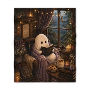 May include: A plush throw blanket featuring a ghost wrapped in a purple knit blanket, reading a book titled Secrets of the Forest. The scene includes a rainy window, a mug labelled Warm Tea Happy Soul, candles, and stacks of books in a cosy room.