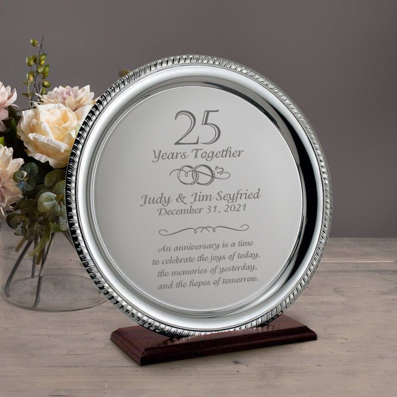 A silver laser engraved anniversary silver plate with  personalize couples names, date and message is the best 25th anniversary gifts for parents