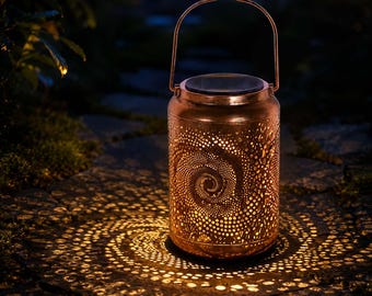 May include: A cylindrical copper-coloured metal lantern featuring a perforated spiral pattern that casts a glowing light. The lantern has a top handle and a solar panel integrated into the lid, emitting a warm light that projects a spiral design.