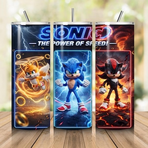May include: A cylindrical metal tumbler with a straw, featuring Sonic the Hedgehog characters Tails, Sonic, and Shadow. The design includes the text SONIC THE POWER OF SPEED, lightning bolts, golden rings, and fiery elements against dark blue and red backgrounds.