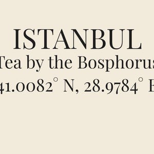 May include: A cream-colored print featuring black text that reads ISTANBUL, Tea by the Bosphorus, and the coordinates 41.0082&deg; N, 28.9784&deg; E. The design uses a clean, serif font centered on a solid, light-toned background with high contrast.