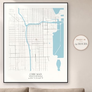 May include: A framed map print of Chicago featuring black street grids, light blue water bodies, and a red location marker. The text reads CHICAGO, Where it all started, 41.8781 N, 87.6298 W. A circular badge on the right says READY IN 24 HOURS.