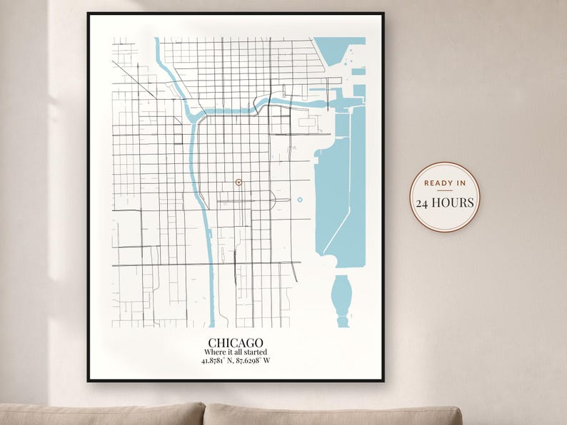 May include: A framed map print of Chicago featuring black street grids, light blue water bodies, and a red location marker. The text reads CHICAGO, Where it all started, 41.8781 N, 87.6298 W. A circular badge on the right says READY IN 24 HOURS.