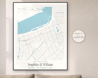 May include: A framed map print featuring a light blue body of water and black street lines. The text reads: OUR FIRST HOME, Sophia & Ethan, BOSTON - SEPTEMBER 3, 2022. A circular badge on the right side displays the text: READY IN 24 HOURS.
