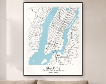 May include: A framed wall art print featuring a minimalist map of New York City. The design displays black street lines against a white background with light blue water bodies. Text at the bottom reads NEW YORK, The City That Never Sleeps, United States.