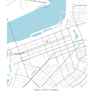 May include: A map print featuring a light blue body of water, black street lines, and a brown circular location marker. Below the map, the text reads: OUR FIRST HOME, Sophia & Ethan, BOSTON, SEPTEMBER 3, 2022, in black lettering.
