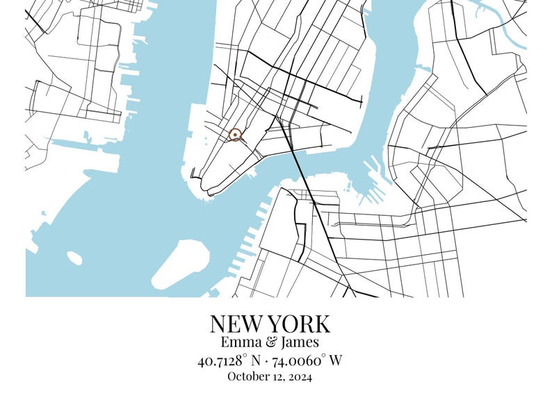 May include: A map print of New York featuring black street lines on a white background with light blue water areas. A small brown circle marks a location. Text reads: NEW YORK, Emma & James, 40.7128&deg; N &middot; 74.0060&deg; W, October 12, 2024.