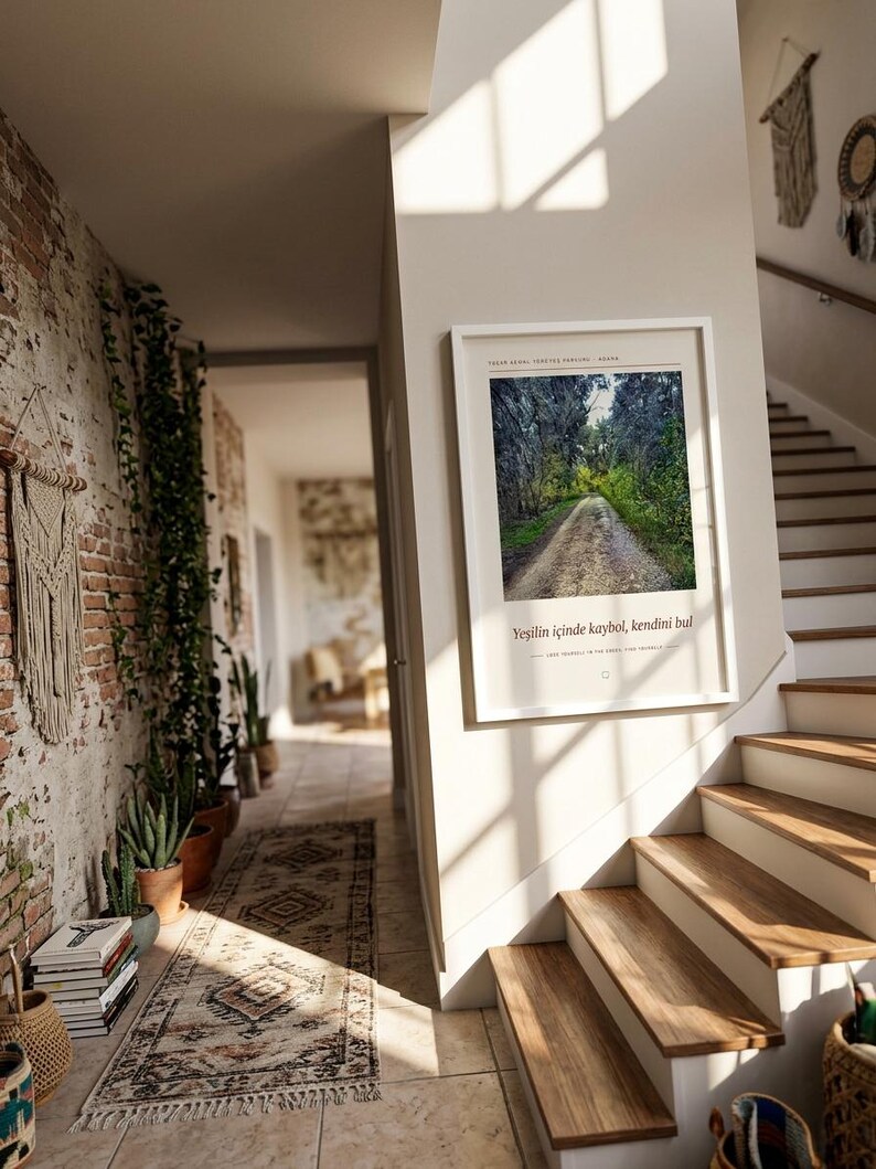 May include: A rectangular white-framed wall art print featuring a photograph of a dirt path winding through a dense green forest. The print includes the Turkish text "Yeşilin i&ccedil;inde kaybol, kendini bul" and English text "Lose yourself in the forest, find yourself."