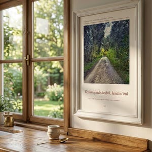 May include: A framed vertical wall art print featuring a dirt path winding through a dense forest. The text reads YAŞAR KEMAL Y&Uuml;R&Uuml;Y&Uuml;Ş PARKURU ADANA and Yeşilin i&ccedil;inde kaybol, kendini bul with the English translation Lose yourself in the green, find yourself.