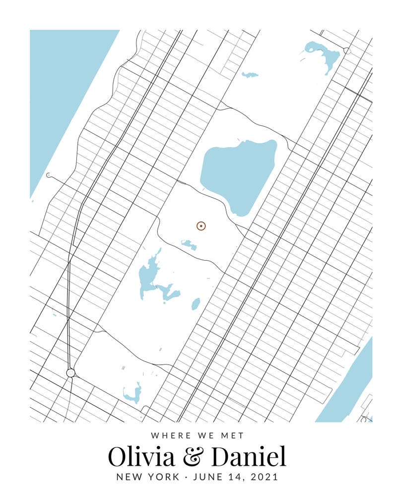 May include: A map print featuring a grid of city streets and light blue water bodies. A small brown circle marks a specific location. Below the map, the text reads: WHERE WE MET, Olivia & Daniel, NEW YORK, JUNE 14, 2021.