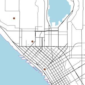 May include: A minimalist map illustration featuring black street grid lines on a white background, with a light blue body of water along the left and top edges. Three small, solid brown circular markers are placed at specific locations.