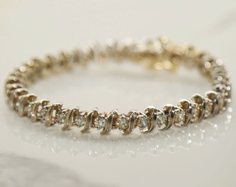 Vintage 14k gold diamond tennis bracelet