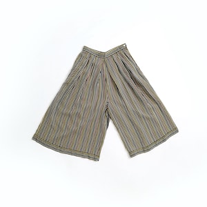 May include: Wide-leg pants with vertical stripes in black, gold, and white. The pants have a high waist and a loose, flowing fit. The fabric appears to be lightweight, suitable for warm weather. The pants are laid flat on a white surface.