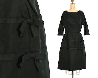Vintage 1950s black silk satin bow cocktail dress