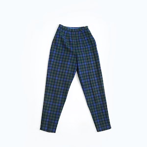 May include: A pair of high-waisted, plaid pants in shades of green, blue, and red. The pants have a straight leg design and a button and zipper closure. The fabric appears to be a woven material, suitable for cooler weather.