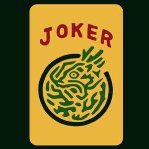 May include: A yellow playing card with the word "JOKER" in red letters and a green and black illustration of a stylized eye in a circle.