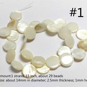 May include: A strand of 29 white mother of pearl beads, approximately 15 inches long. Each bead is about 14 mm in diameter and 2.5 mm thick with a 1 mm hole.