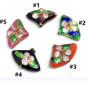 May include: Five enamel cloisonné beads with a flower design. The beads are in various colors, including red, green, black, pink, and blue. Each bead is numbered #1 through #5.