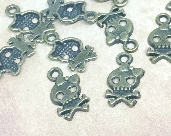 12pc 16x9mm antique bronze finish metal skull pendant-7132h