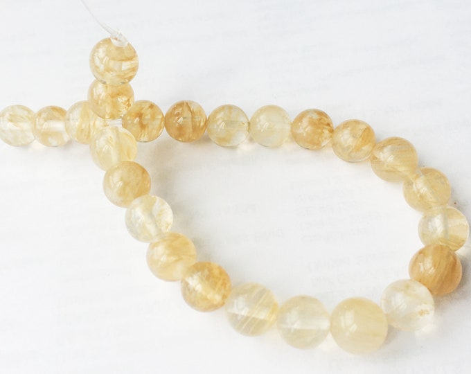 7.5 Inch Strand Of 8mm Round Topaz Jade Beads -r150
