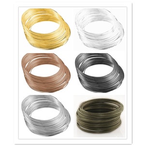 May include: Six spools of wire in different colors: gold, silver, copper, black, silver, and green. Each spool is made up of many individual wire loops.
