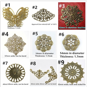 May include: Nine different metal filigree embellishments in various shapes and sizes, including a butterfly, a crescent, a circle, and a square. The embellishments are all gold in color and have intricate designs. The embellishments are labeled with numbers 1 through 9.