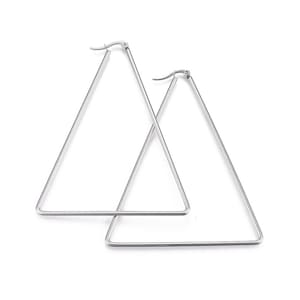 May include: A pair of silver triangle hoop earrings. The earrings are large and have a simple design.