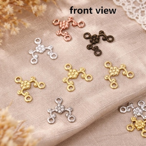 May include: A set of three ceramic mugs with a speckled, matte finish. The mugs are in shades of cream, light gray, and dark gray. Each mug has a simple, minimalist design and a rounded handle.