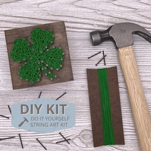 May include: DIY string art kit featuring a green shamrock design on a wooden base. The kit includes green string, nails, and a hammer.