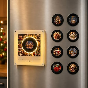 May include: A square acrylic plaque featuring a grid of Christmas images and a central circular light, accompanied by eight small circular magnets. Each magnet displays a unique holiday scene, including a tree, gift, mug, and ornament.