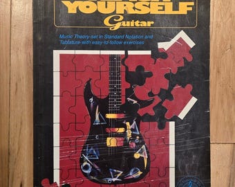 Libro para aprender a tocar la guitarra de Bob Hartz: Notación estándar y tablatura.