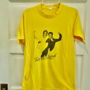 Vintage 80s/1983 TWO Of A Kind Olivia Newton John John Travolta Graphic Print Movie Promo T Shirt Distressed Authentic sz XS/S