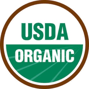 May include: A brown circle with a white background and green text. The text reads "USDA Organic".