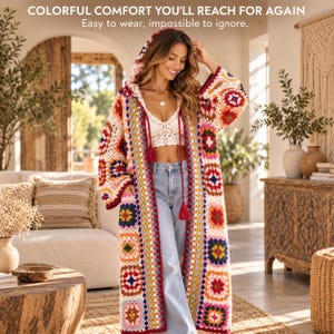 Può includere: Un lungo cardigan all'uncinetto con cappuccio e un motivo a piastrelle granny multicolore nei toni del rosso, blu, giallo e rosa. Il capo presenta maniche lunghe, un cappuccio con nappe rosse e un'apertura frontale. Testo: COLORFUL COMFORT YOU'LL REACH FOR AGAIN. Easy to wear, impossible to ignore.