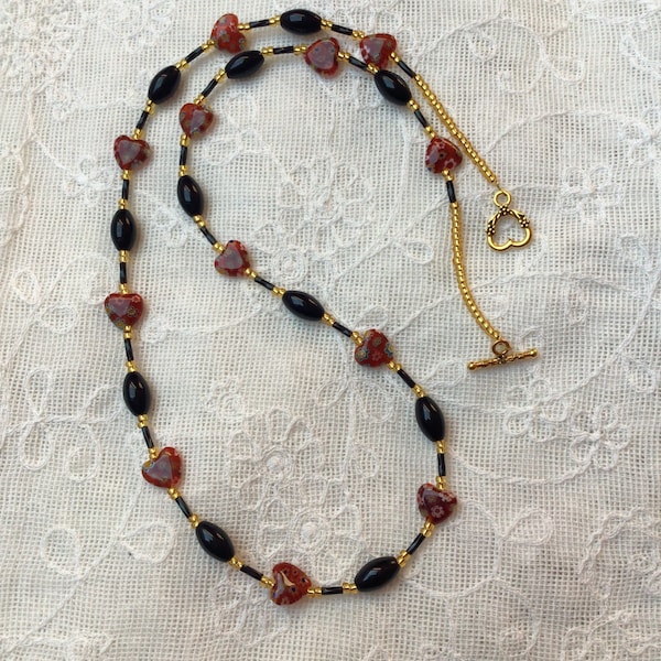 Long collier de perles rouge Millefiori coeur