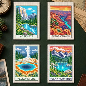 May include: Four rectangular cross stitch patterns featuring national parks: Yosemite with mountains and river, Grand Canyon with red rock formations, Yellowstone with a geyser and hot spring, and Rocky Mountain with a lake and peaks.
