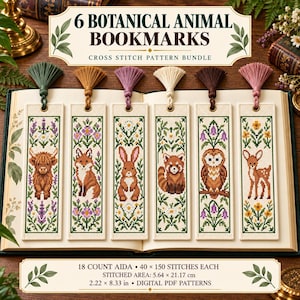 May include: Six rectangular cross stitch bookmarks featuring botanical animal designs including a highland cow, fox, rabbit, red panda, owl, and deer. Each bookmark has a colored tassel and measures 2.22 by 8.33 inches, 5.64 by 21.17 cm.