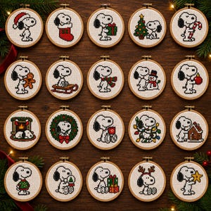 May include: Twenty circular wooden embroidery hoops containing cross-stitch patterns of the character Snoopy in various holiday-themed scenes, including Christmas trees, presents, stockings, snowmen, and reindeer antlers on a dark wood background.