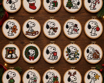 May include: Twenty circular wooden embroidery hoops containing cross-stitch patterns of the character Snoopy in various holiday-themed scenes, including Christmas trees, presents, stockings, snowmen, and reindeer antlers on a dark wood background.