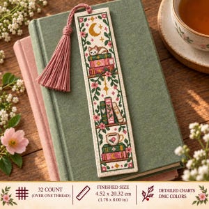 May include: A rectangular cross-stitch bookmark featuring a sleeping cat on books, a teacup, and floral vines with a crescent moon. It includes a pink tassel and measures 1.78 by 8.00 inches, with 32 count fabric and detailed DMC color charts.
