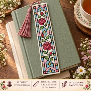 May include: A rectangular cross-stitch bookmark featuring a stained-glass window pattern with red roses, green leaves, and blue and pink geometric borders. It includes a dusty rose tassel and measures 4.52 by 20.32 cm as stated in the text.