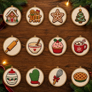 May include: Twelve circular wooden embroidery hoops containing cross-stitch designs of holiday baking items, including a gingerbread house, gingerbread people, a star cookie, a Christmas tree, a rolling pin, a mixing bowl, a cupcake, and a mug.